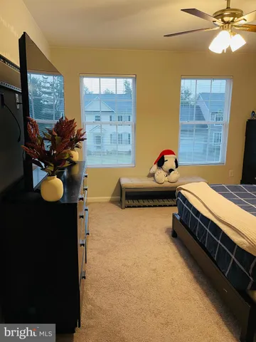 a bedroom with bed and window