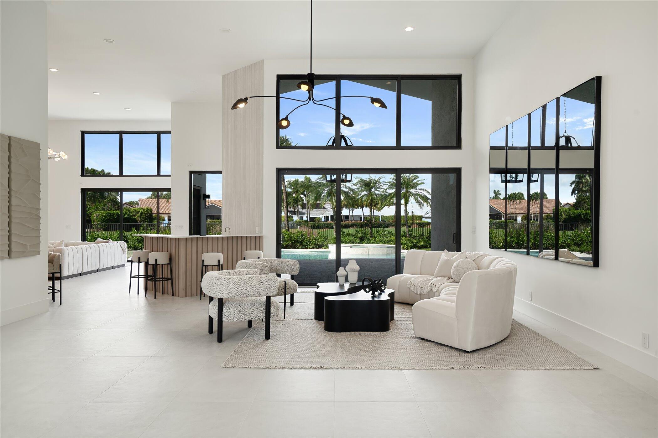 4459 Bocaire Boulevard Boca Raton, FL 33487 - Photo 11 of 72 a living room with furniture and a large window