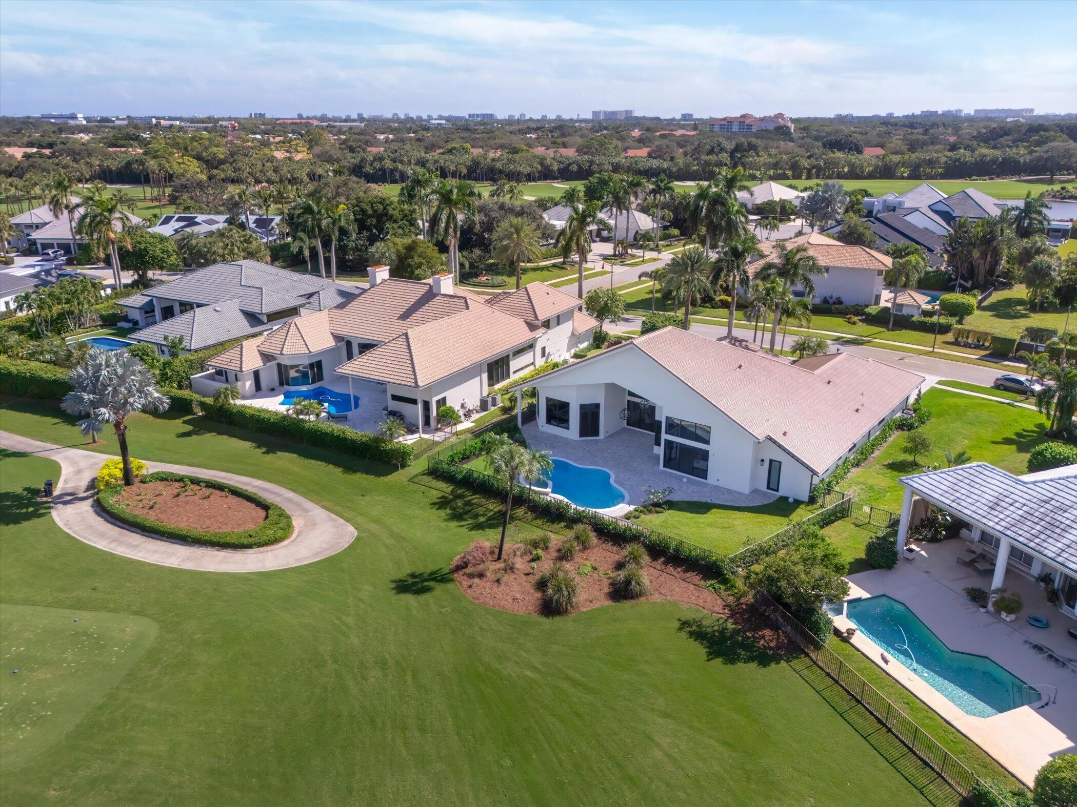 4459 Bocaire Boulevard Boca Raton, FL 33487 - Photo 2 of 72 an aerial view of a house with a garden and lake view