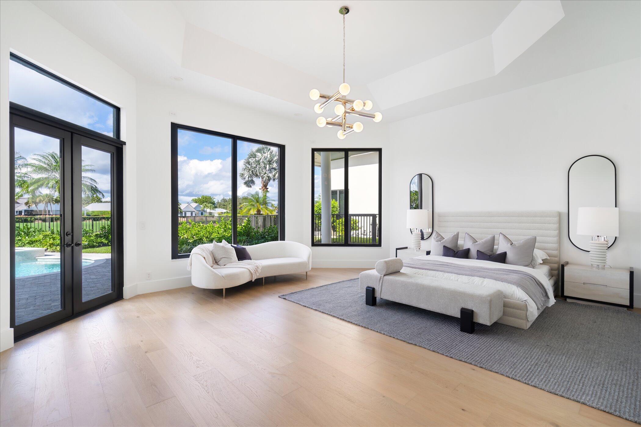 4459 Bocaire Boulevard Boca Raton, FL 33487 - Photo 35 of 72 a spacious bedroom with bed and a large window