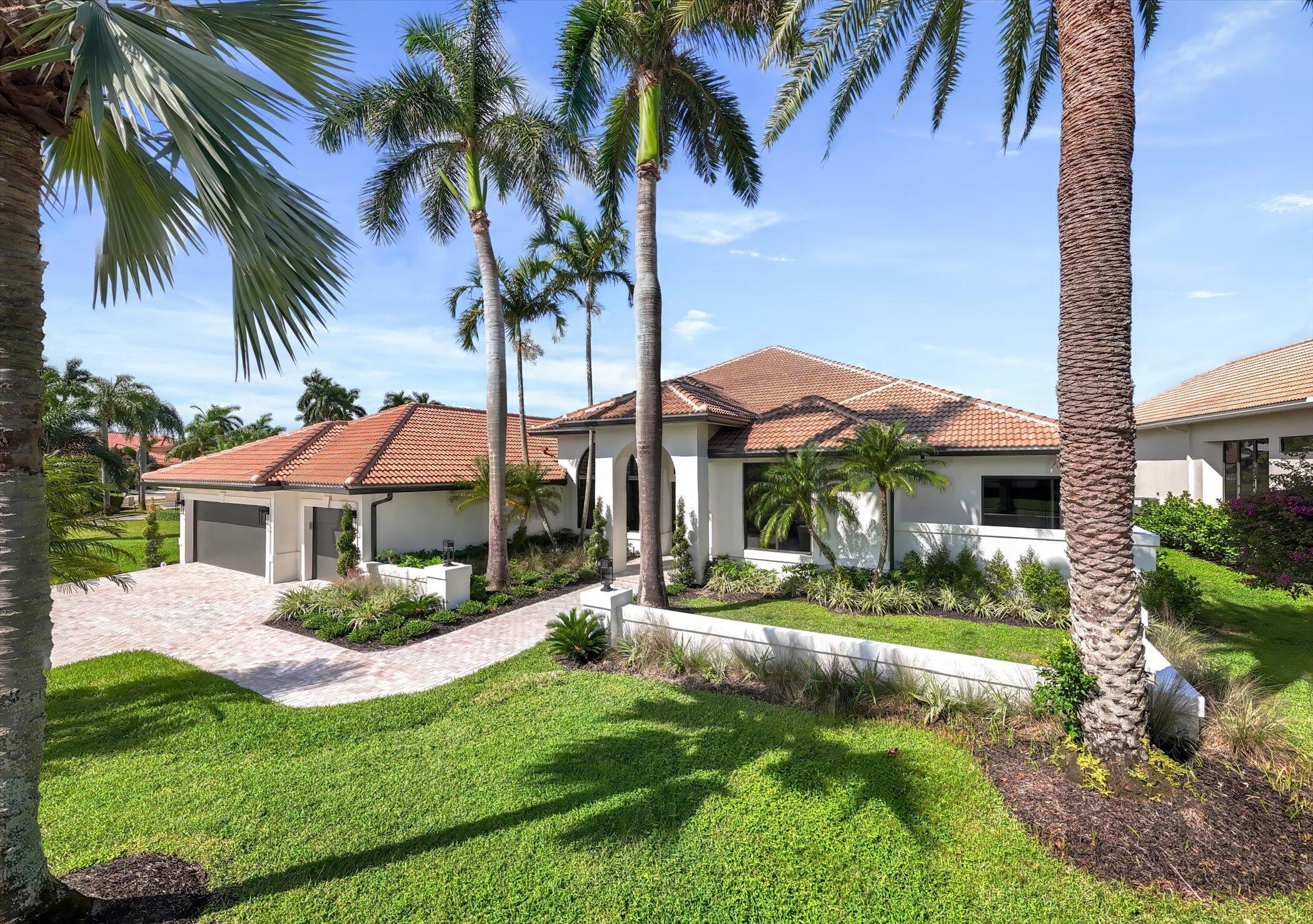 4459 Bocaire Boulevard Boca Raton, FL 33487 - Photo 49 of 72 a front view of house with yard and green space