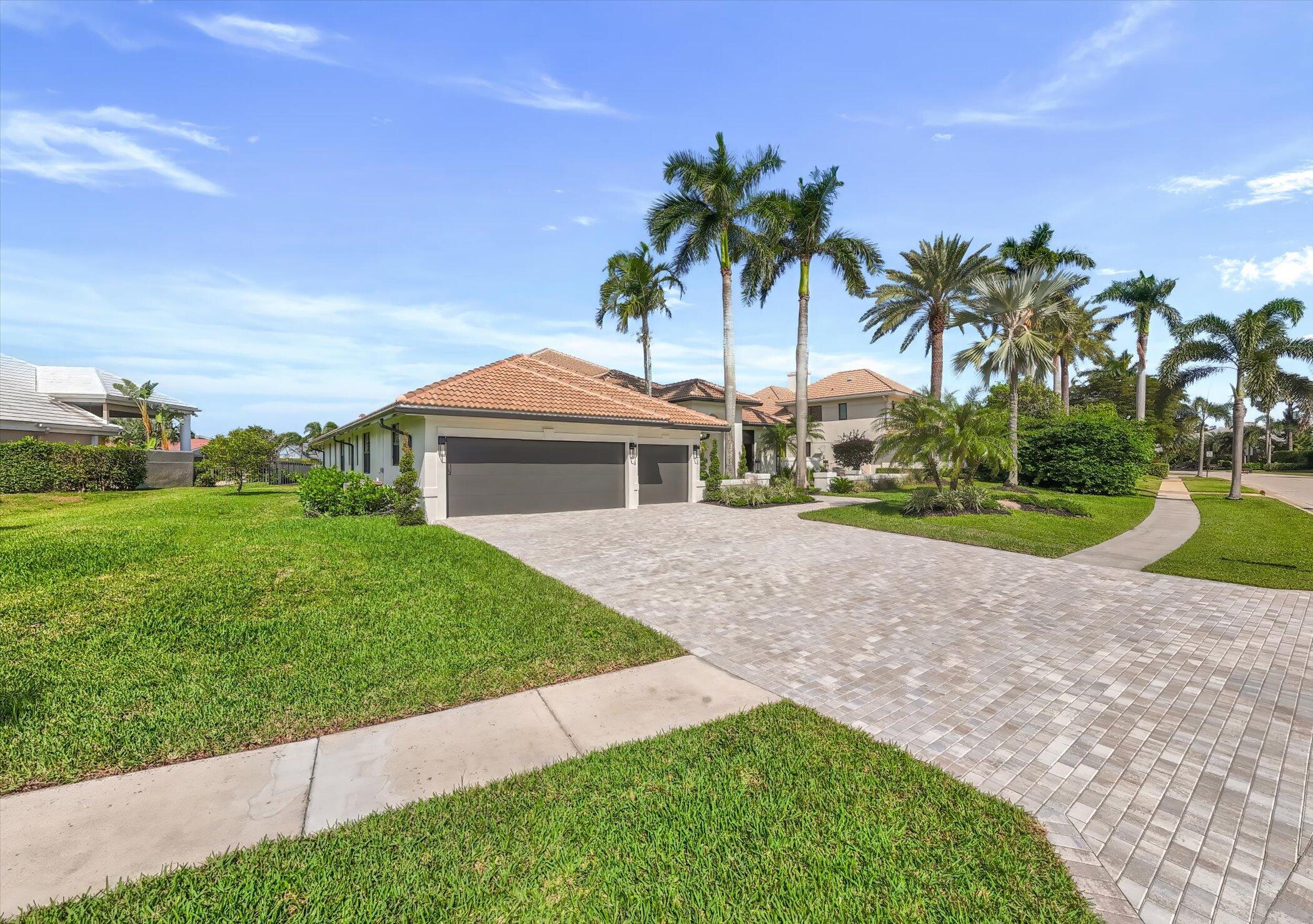 4459 Bocaire Boulevard Boca Raton, FL 33487 - Photo 52 of 72 a front view of a house with garden