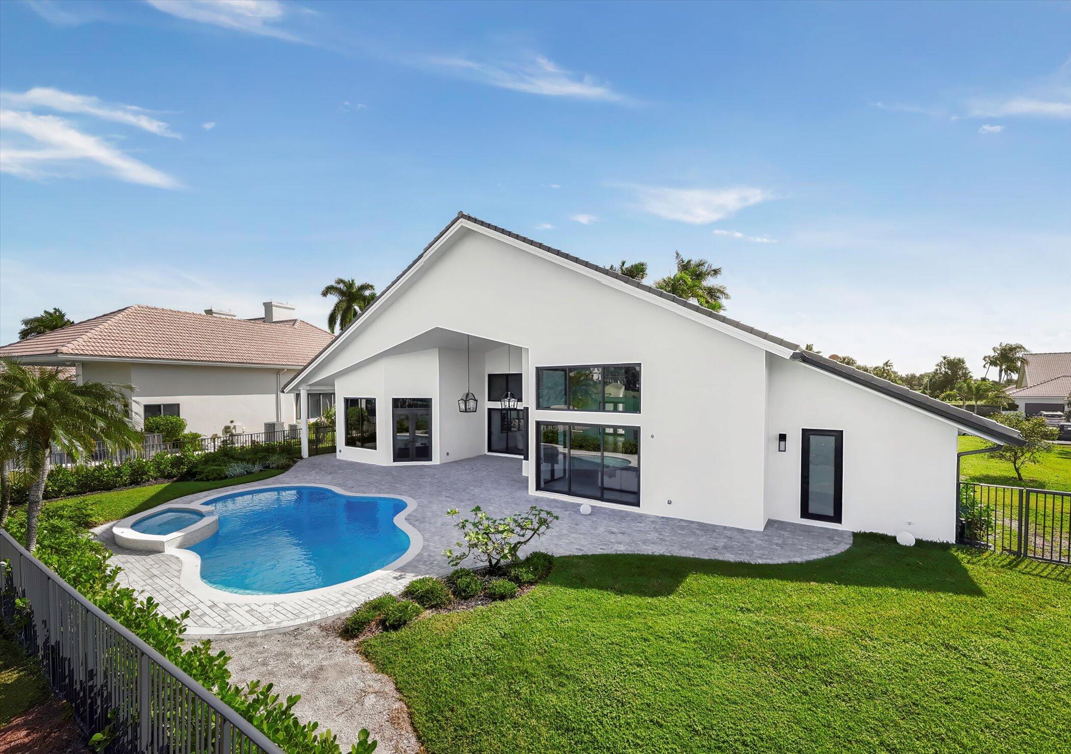 4459 Bocaire Boulevard Boca Raton, FL 33487 - Photo 56 of 72 a front view of a house with garden