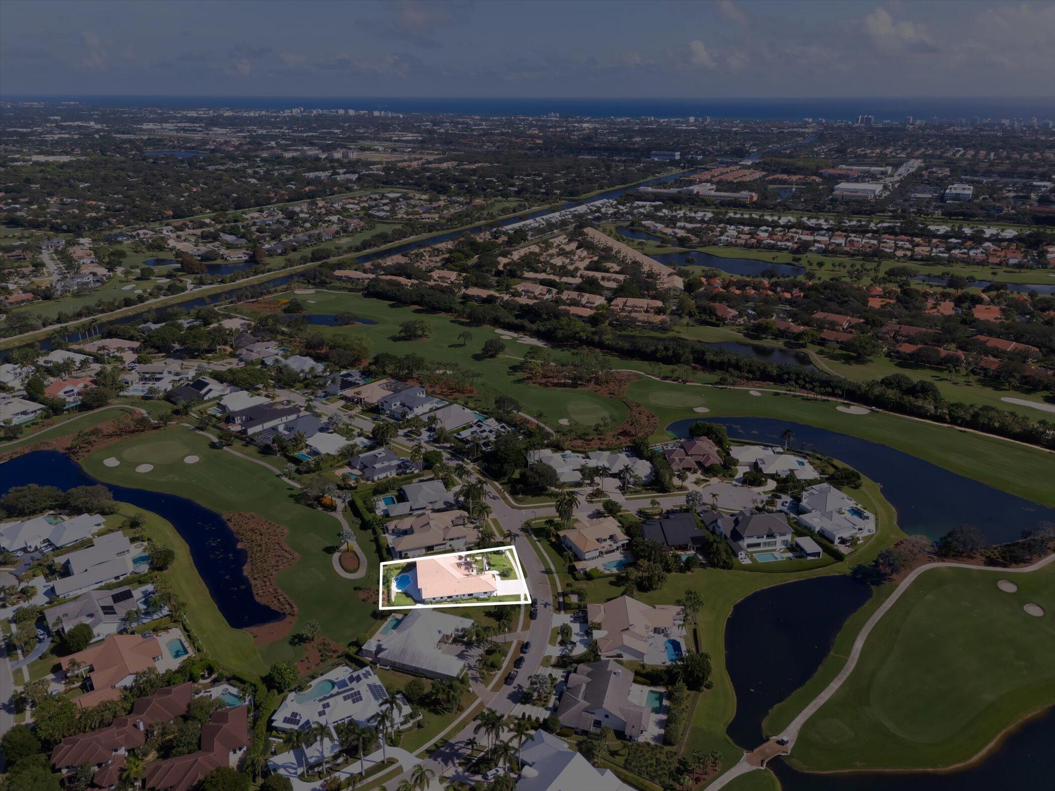 4459 Bocaire Boulevard Boca Raton, FL 33487 - Photo 72 of 72 an aerial view of a house with a yard