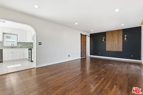 a view of a kitchen with a sink and a stove top oven