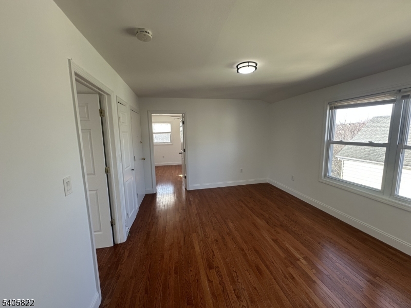 26 Van Rensselear Street, Unit 3 Belleville, NJ 07109 - Photo 2 of 12 wooden floor in an empty room with a window