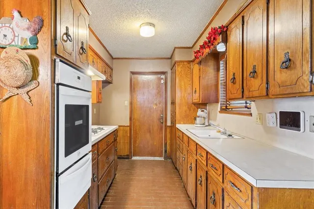 a bathroom with a sink a mirror and a shower