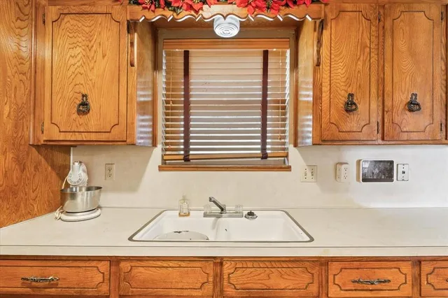 a kitchen with a sink and a window