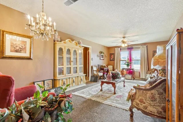 a living room filled with furniture chandelier and a chandelier