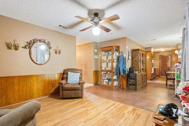 a bedroom with a bed and ceiling fan