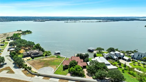 an aerial view of a house with a lake view