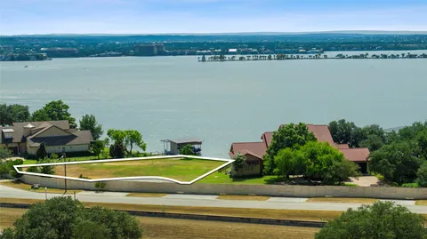 an aerial view of a house with a swimming pool and outdoor space