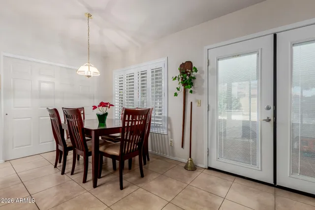 a view of a dining room with furniture and front door
