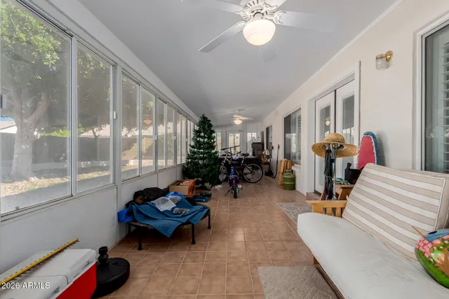 a living room with furniture and a large window