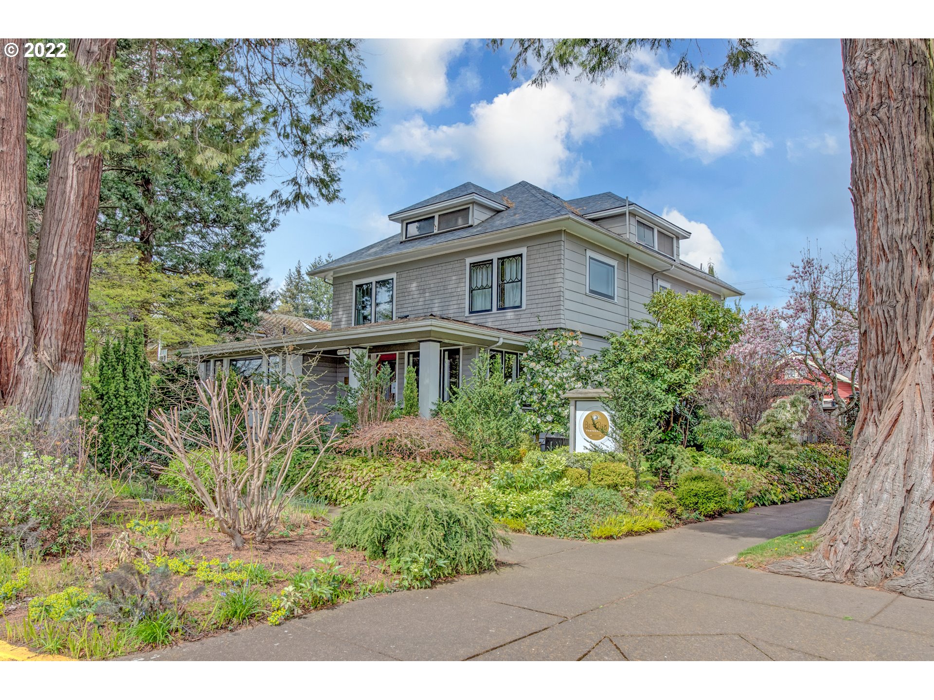448 D Street Springfield, OR 97477 - Photo 1 of 32 a front view of a house with a garden