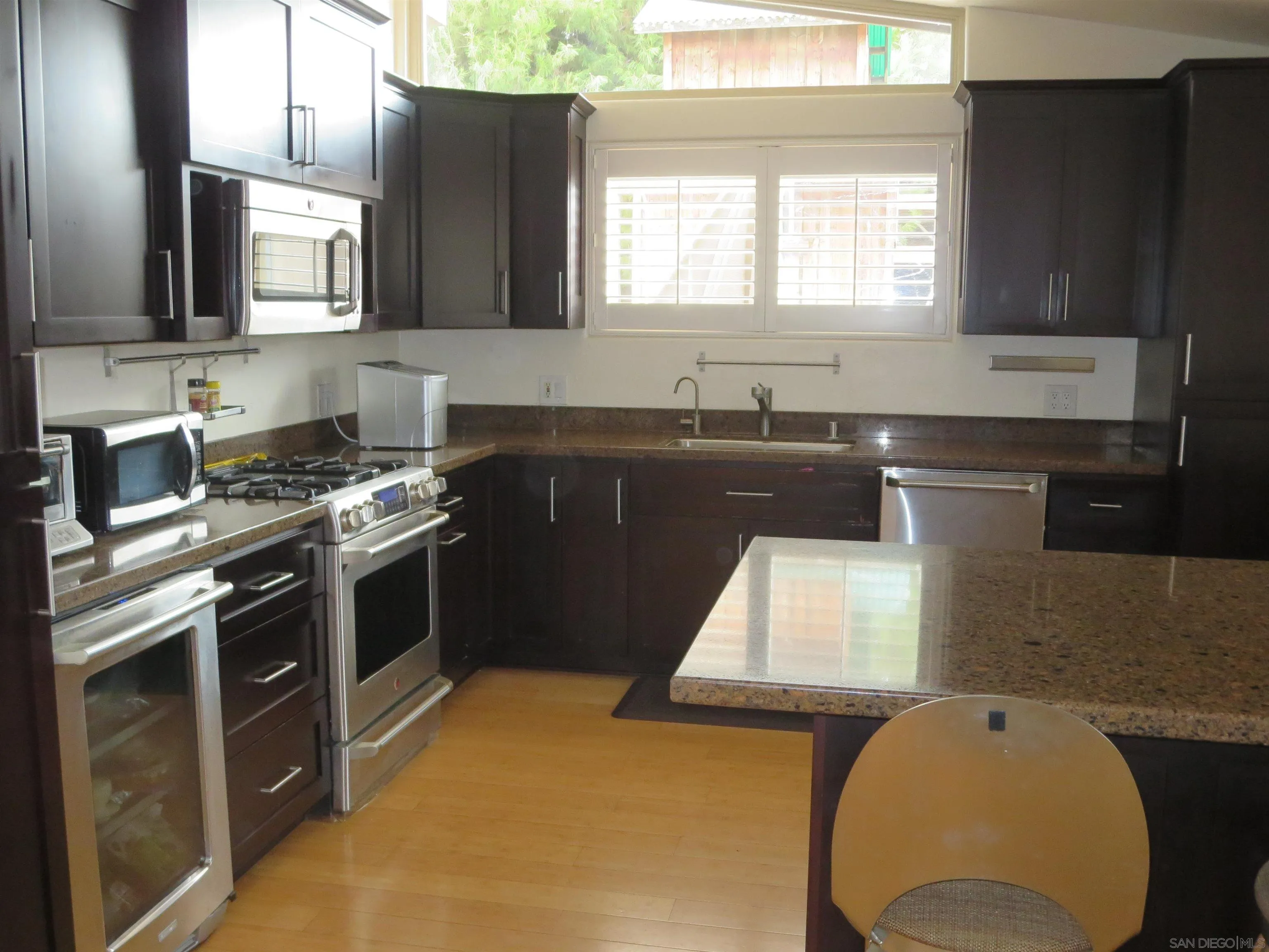14223 Frame Road Poway, CA 92064 - Photo 12 of 44 a kitchen with stainless steel appliances granite countertop a stove a sink and a microwave