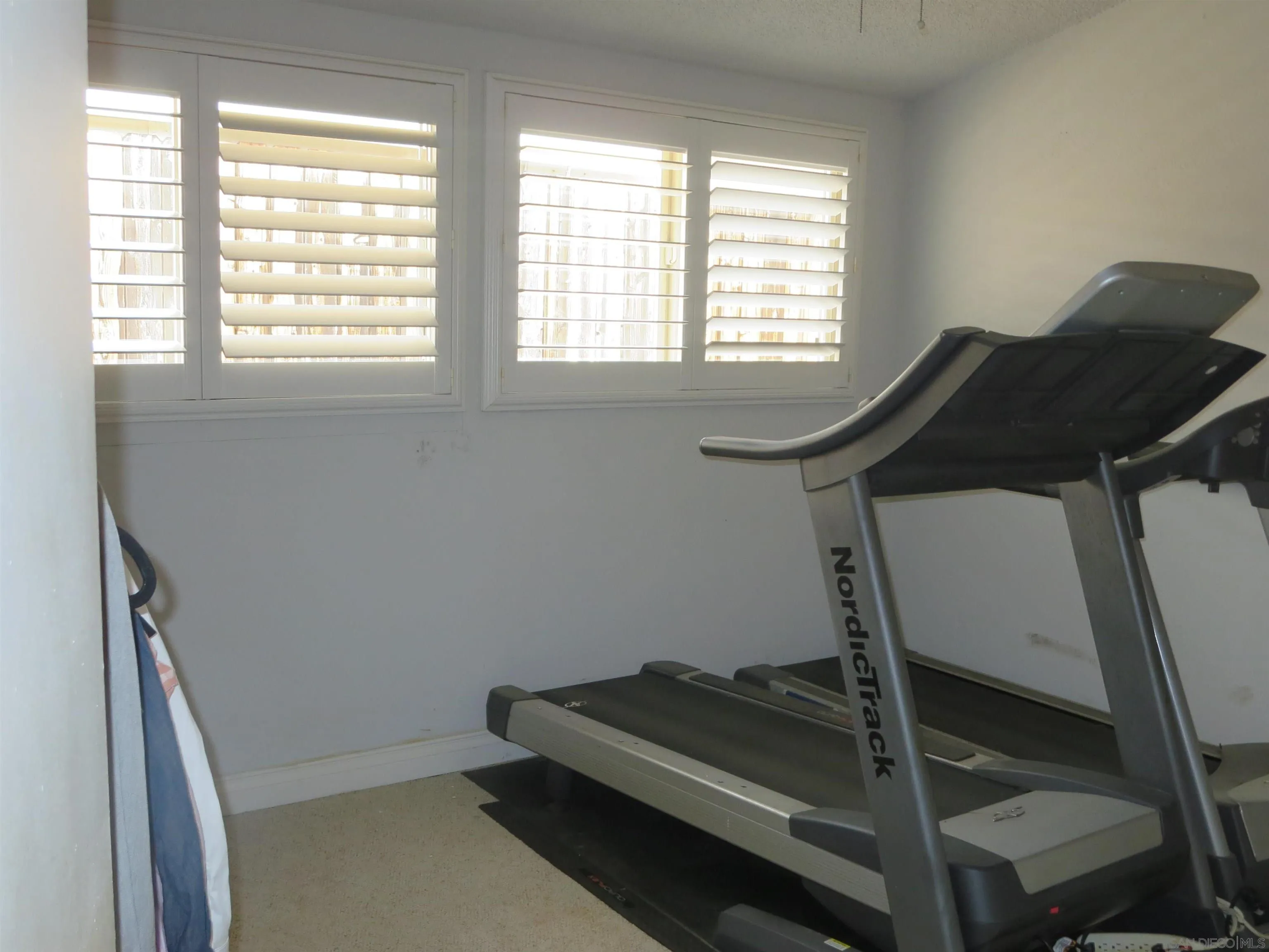 14223 Frame Road Poway, CA 92064 - Photo 21 of 44 a room with gym equipment on wooden floor