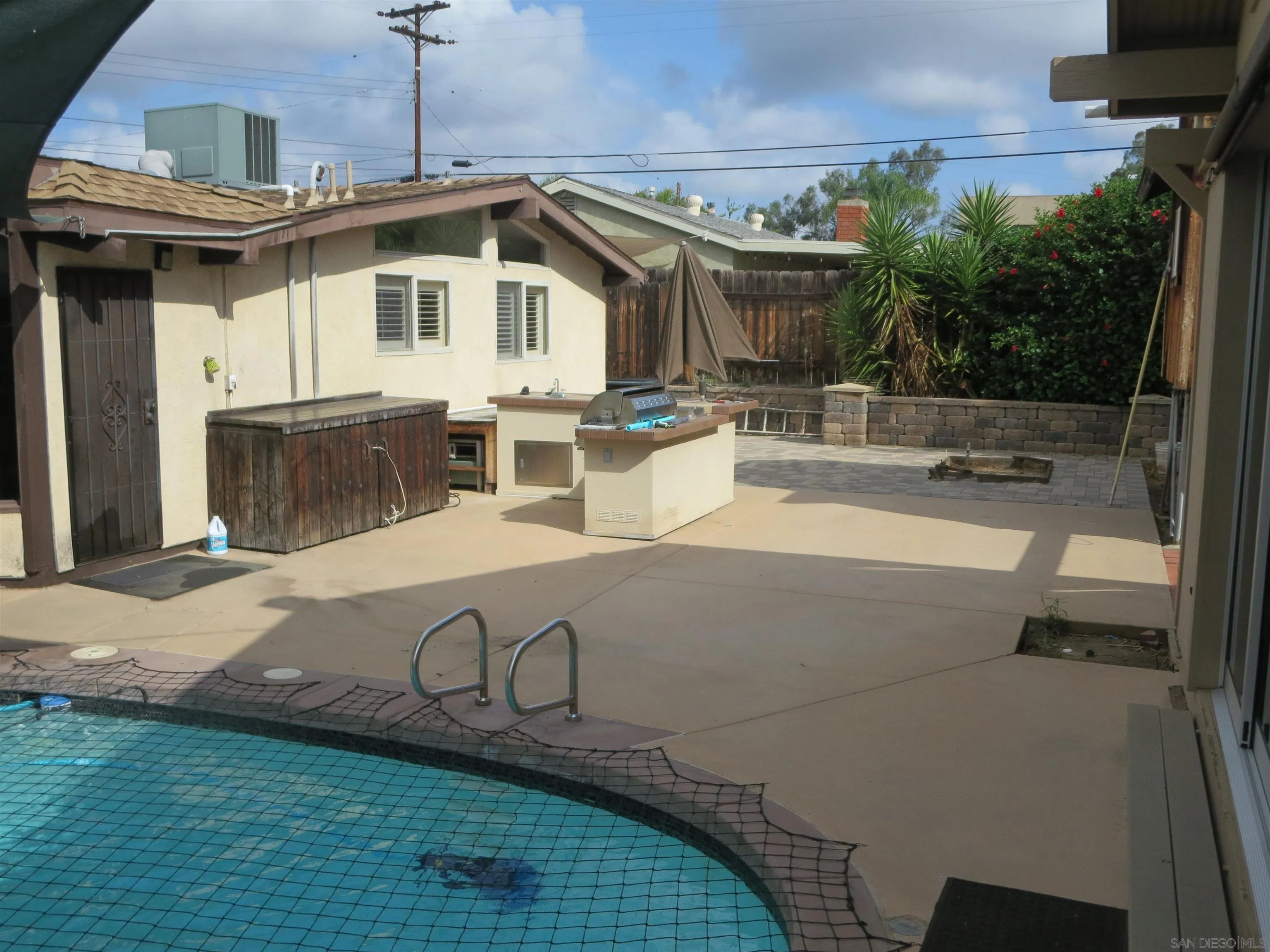 14223 Frame Road Poway, CA 92064 - Photo 26 of 44 a view of a house with pool and chairs