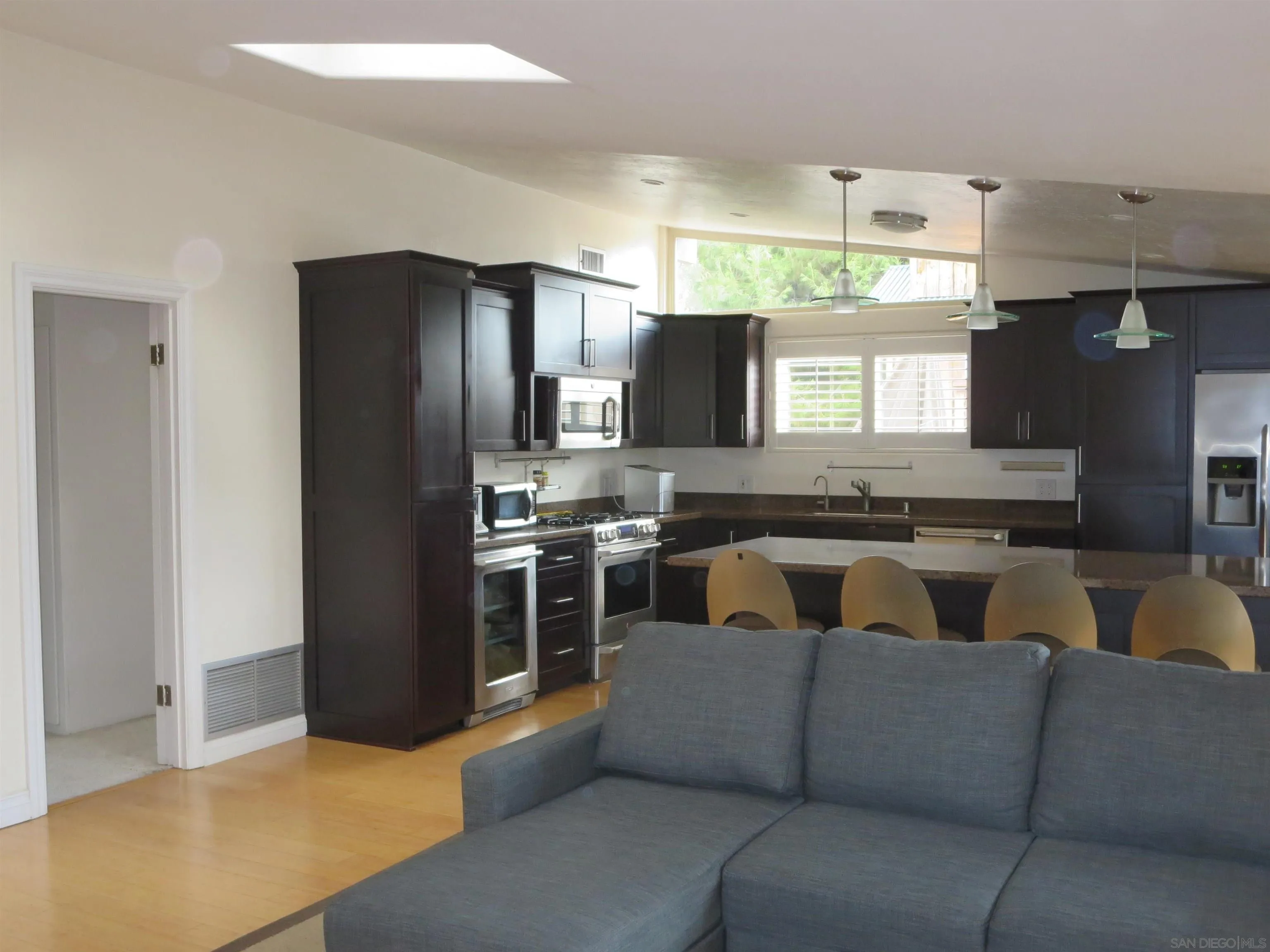 14223 Frame Road Poway, CA 92064 - Photo 10 of 44 a living room with furniture and a kitchen