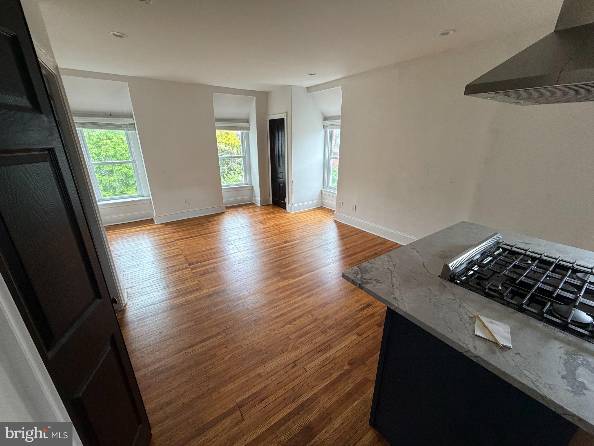 815 South 49th Street Philadelphia, PA 19143 - Photo 39 of 72 wooden floor in an empty room with a window