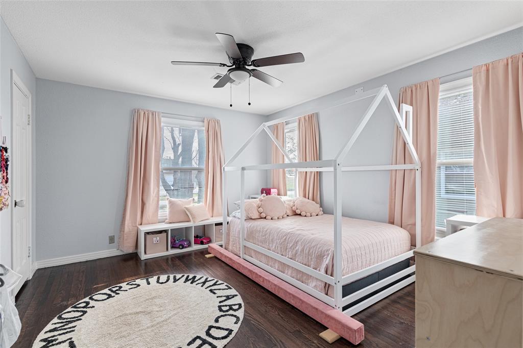 1308 Myrtle Street Denton, TX 76201 - Photo 17 of 35 a bedroom with a bed and window