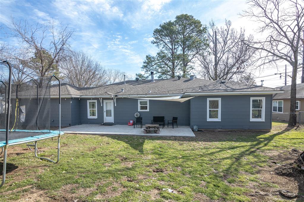 1308 Myrtle Street Denton, TX 76201 - Photo 18 of 35 a house view with swimming pool and wooden fence