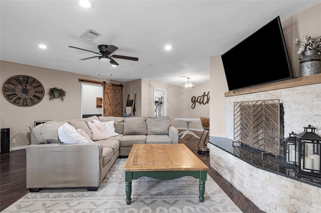 1308 Myrtle Street Denton, TX 76201 - Photo 20 of 35 a living room with furniture and a flat screen tv