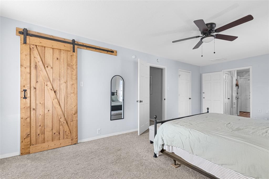 1308 Myrtle Street Denton, TX 76201 - Photo 2 of 35 a bedroom with a bed and a window