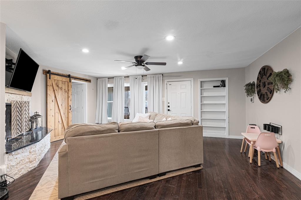 1308 Myrtle Street Denton, TX 76201 - Photo 27 of 35 a living room with furniture and a flat screen tv