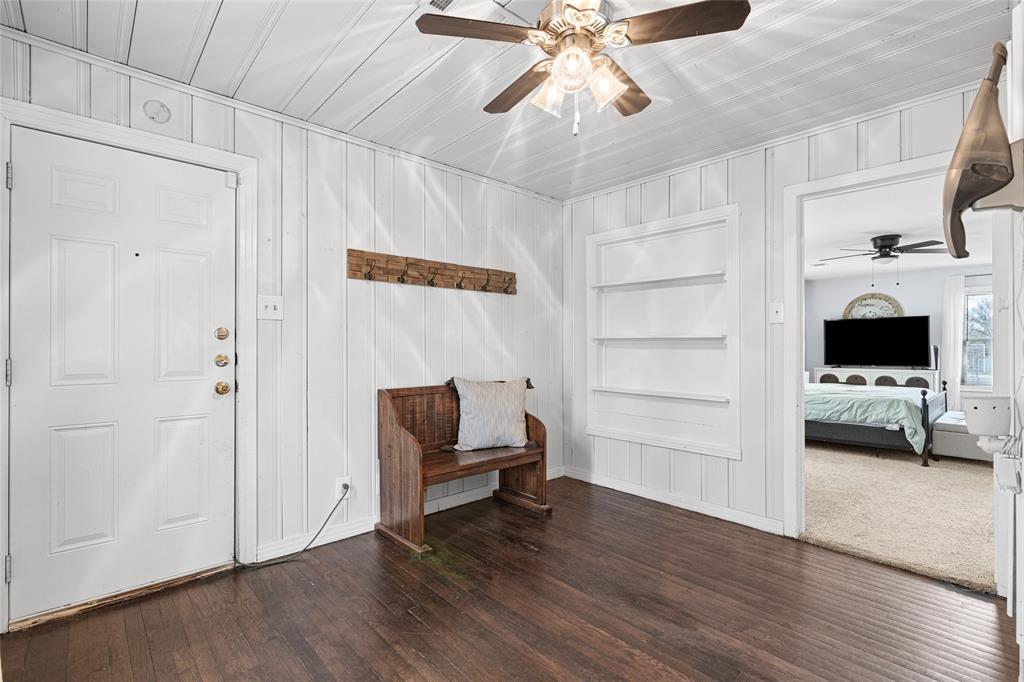 1308 Myrtle Street Denton, TX 76201 - Photo 30 of 35 a view of an empty room with a fireplace and wooden floor