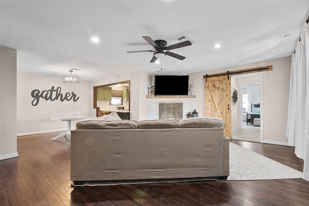 1308 Myrtle Street Denton, TX 76201 - Photo 4 of 35 a living room with furniture and a flat screen tv
