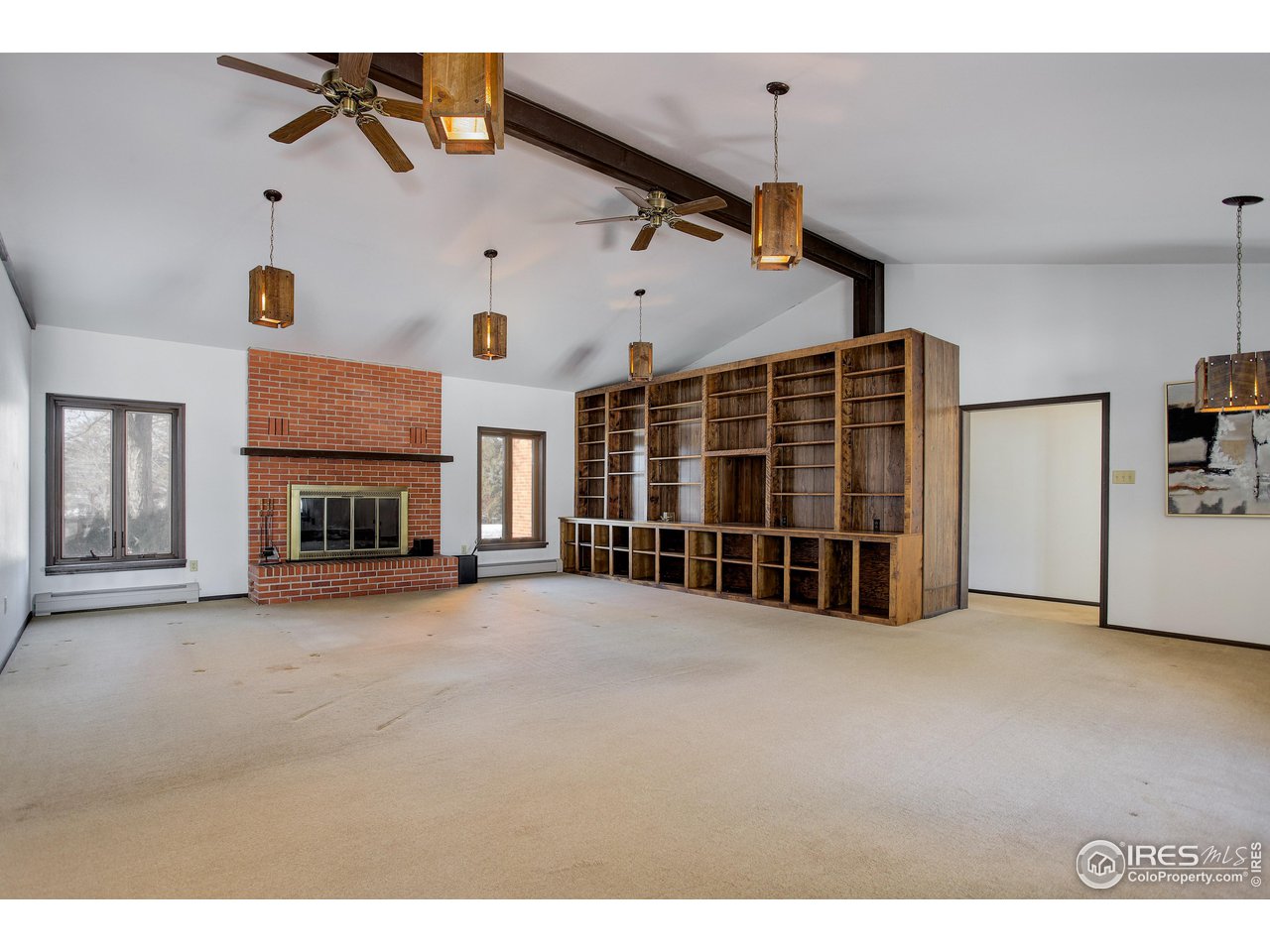 2400 Park Lake Drive Boulder, CO 80301 - Photo 13 of 32 a view of an empty room with fireplace and a window