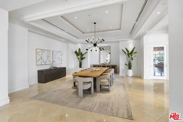 a bedroom with a large bed and a large window