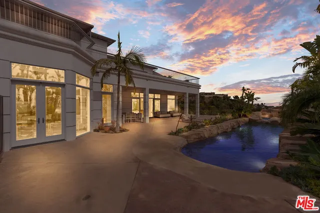 a view of swimming pool with outdoor seating