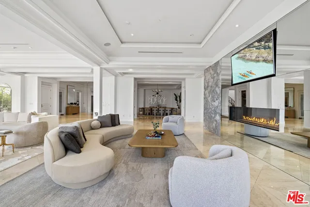 a view of a dining room with furniture and chandelier