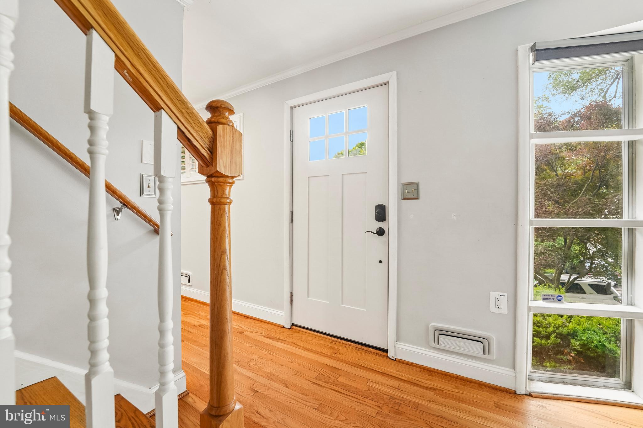 6640 Loch Hill Road Baltimore, MD 21239 - Photo 8 of 35 a view of an entryway with wooden floor and door