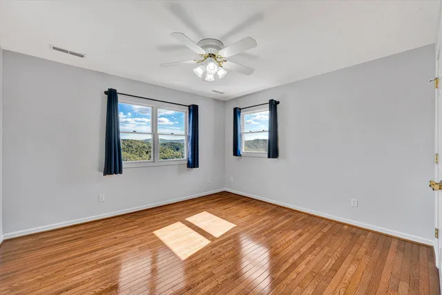 a view of a porch with wooden floor