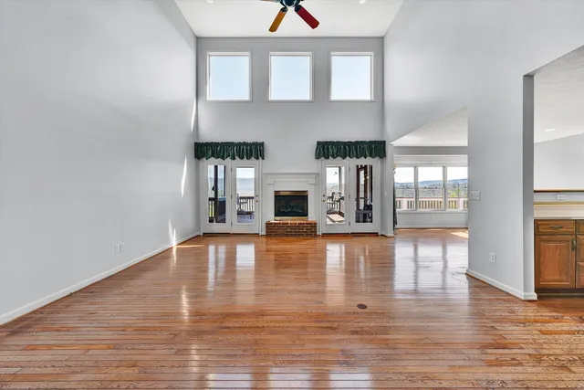 a view of a living room kitchen with furniture and flat screen tv
