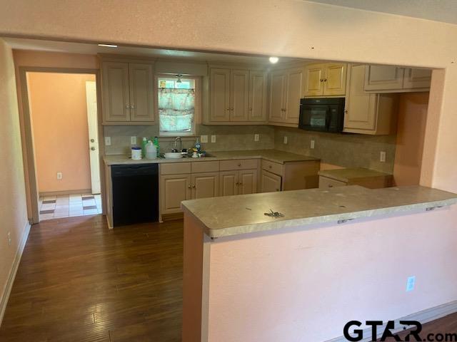11787 Wood Springs Road Tyler, TX 75706 - Photo 3 of 13 a kitchen with a sink and a stove top oven