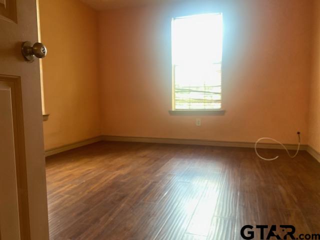 11787 Wood Springs Road Tyler, TX 75706 - Photo 9 of 13 an empty room with a window