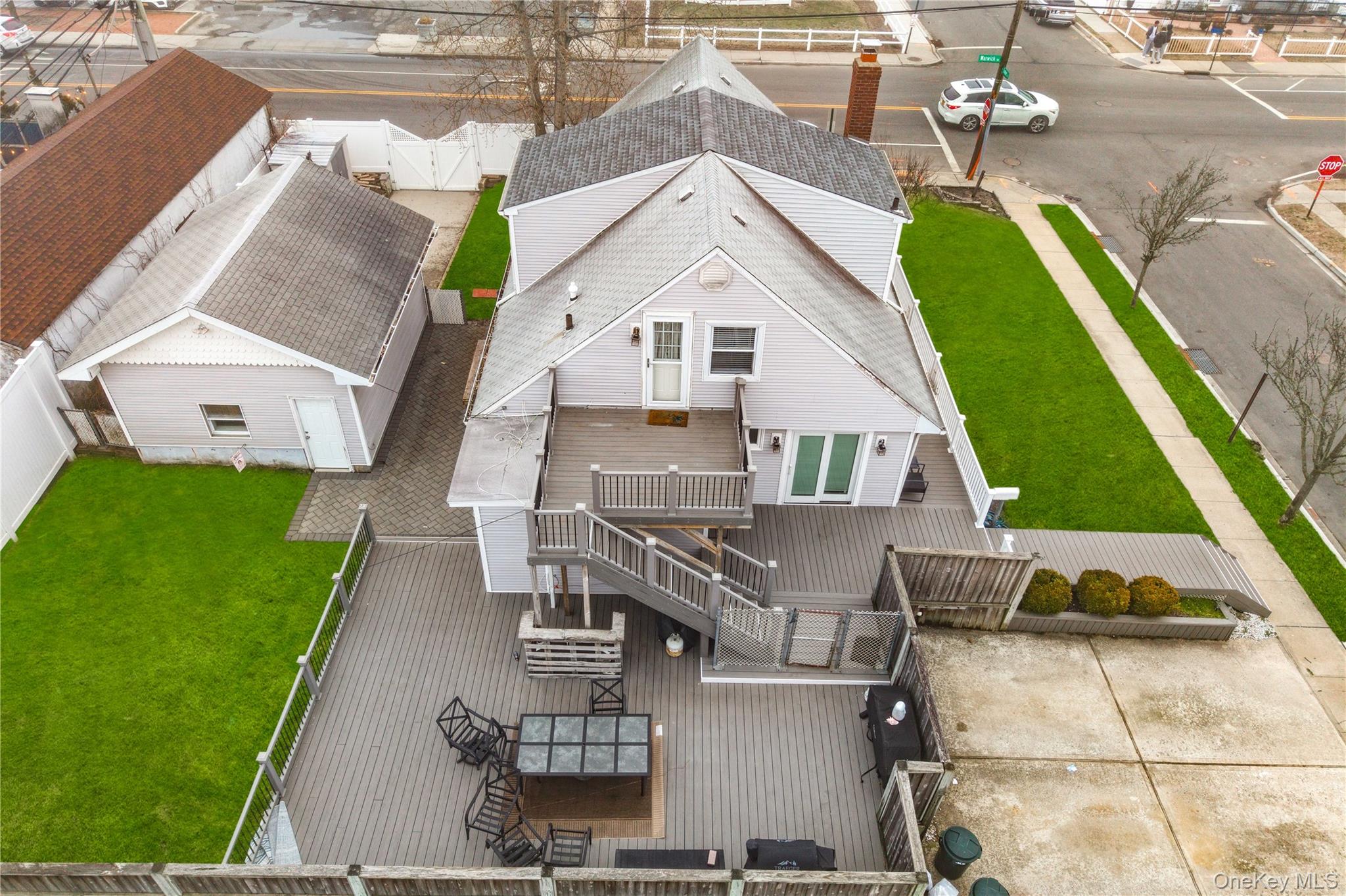 96 Warwick Road Island Park, NY 11558 - Photo 2 of 13 an aerial view of multiple houses with a yard