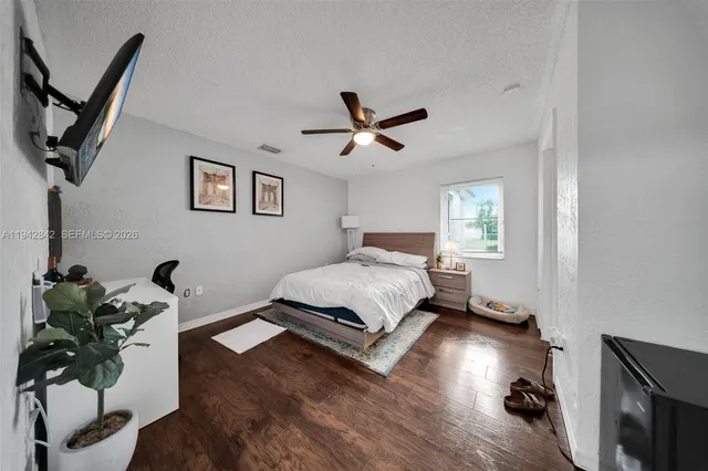 a bed room with a bed and a chandelier