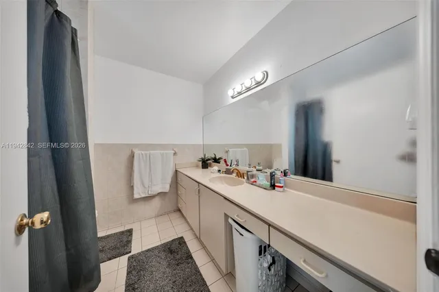 a bathroom with a sink a vanity and a mirror