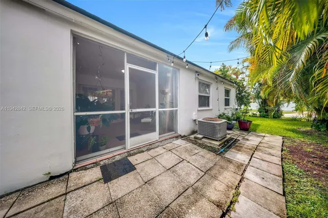 a view of a chairs and fire pit in the patio