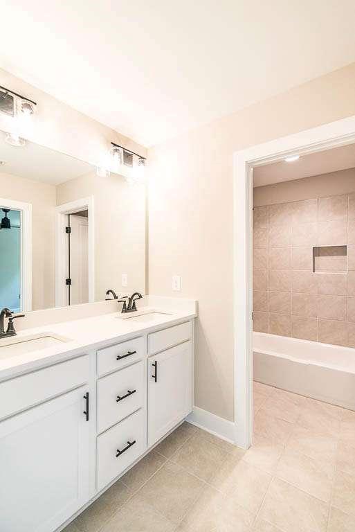 2545 Waldrop Ridge Court Decatur, GA 30034 - Photo 15 of 31 a spacious bathroom with a double vanity sink a mirror and a bathtub