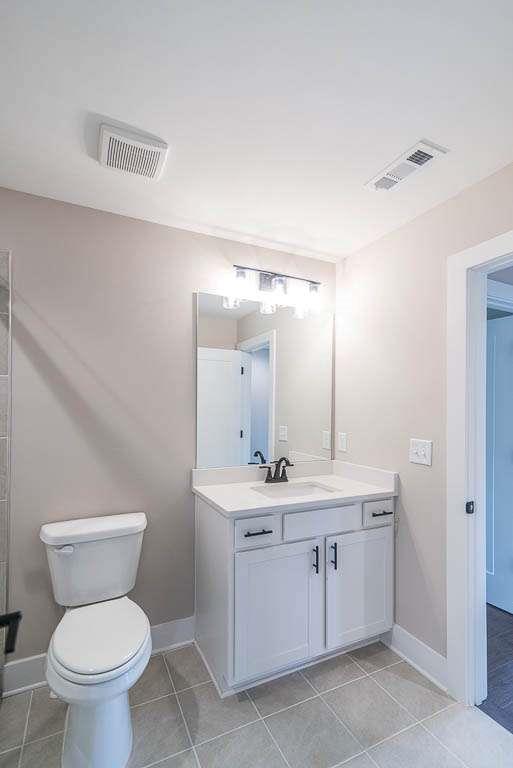 2545 Waldrop Ridge Court Decatur, GA 30034 - Photo 21 of 31 a bathroom with a toilet sink and mirror
