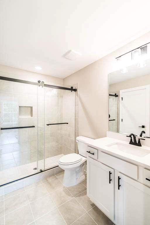 2545 Waldrop Ridge Court Decatur, GA 30034 - Photo 22 of 31 a bathroom with a sink toilet and shower