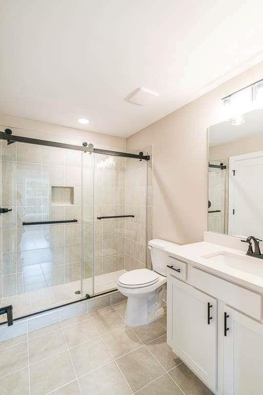 2545 Waldrop Ridge Court Decatur, GA 30034 - Photo 23 of 31 a bathroom with a sink toilet and shower