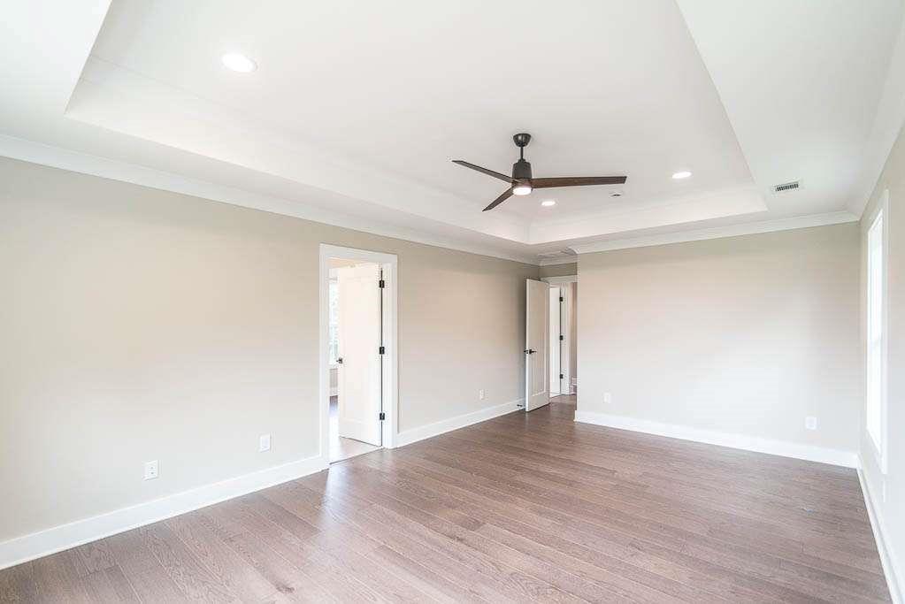 2545 Waldrop Ridge Court Decatur, GA 30034 - Photo 28 of 31 an empty room with a wooden floor and ceiling fan