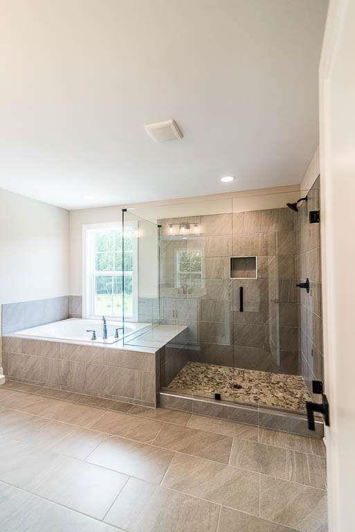2545 Waldrop Ridge Court Decatur, GA 30034 - Photo 30 of 31 a spacious bathroom with a tub shower and sink